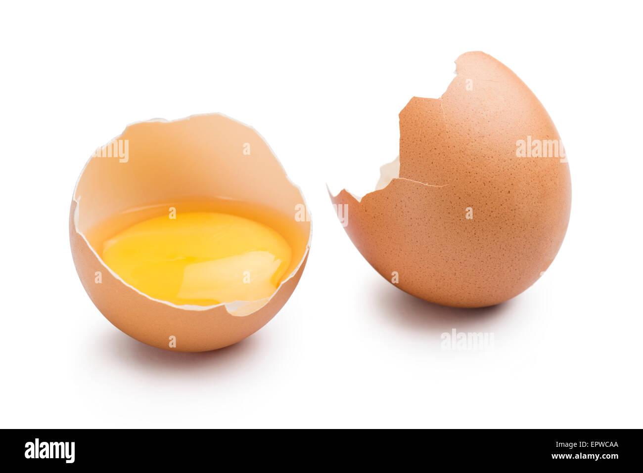 open egg with yolk on white background Stock Photo Alamy