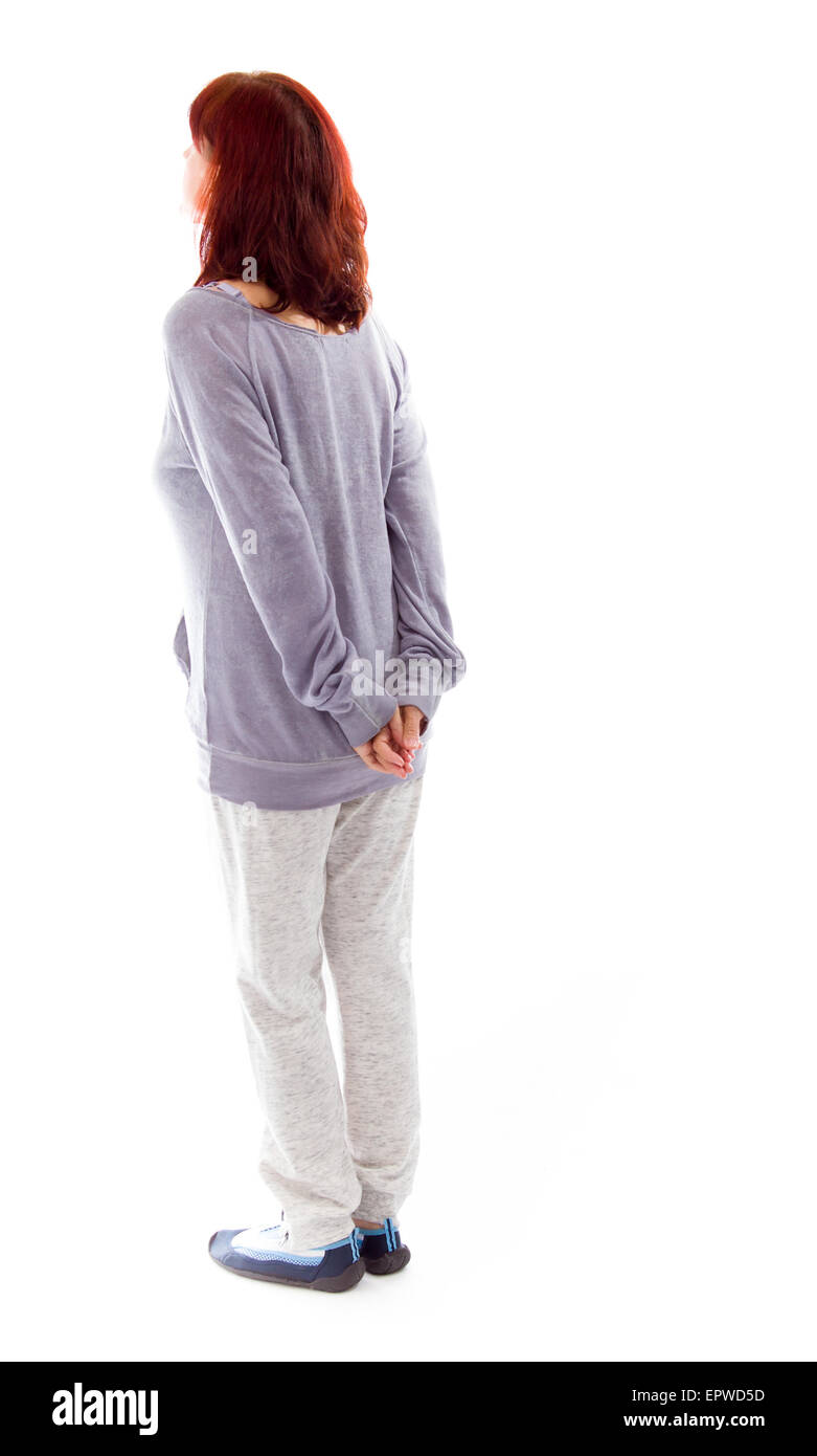 Rear view of a mature woman thinking with her hands behind back Stock ...
