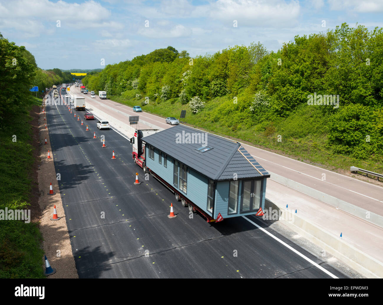 Mobile home being transported on a motorway during resurfacing on the M54 near Shifnal in Shropshire, England. Stock Photo