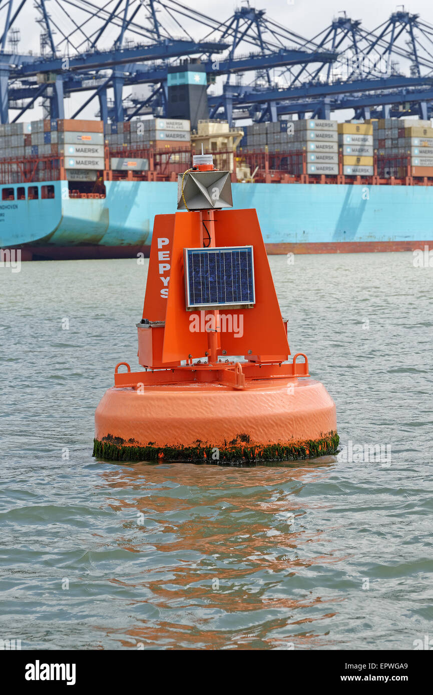 A red navigation buoy marking the port side of the shipping channel in