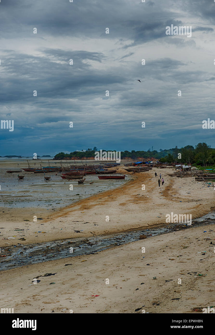 Sandy beach and fishing boats , Dar es Salaam, Tanzania, East Africa, storm clouds forming Stock Photo