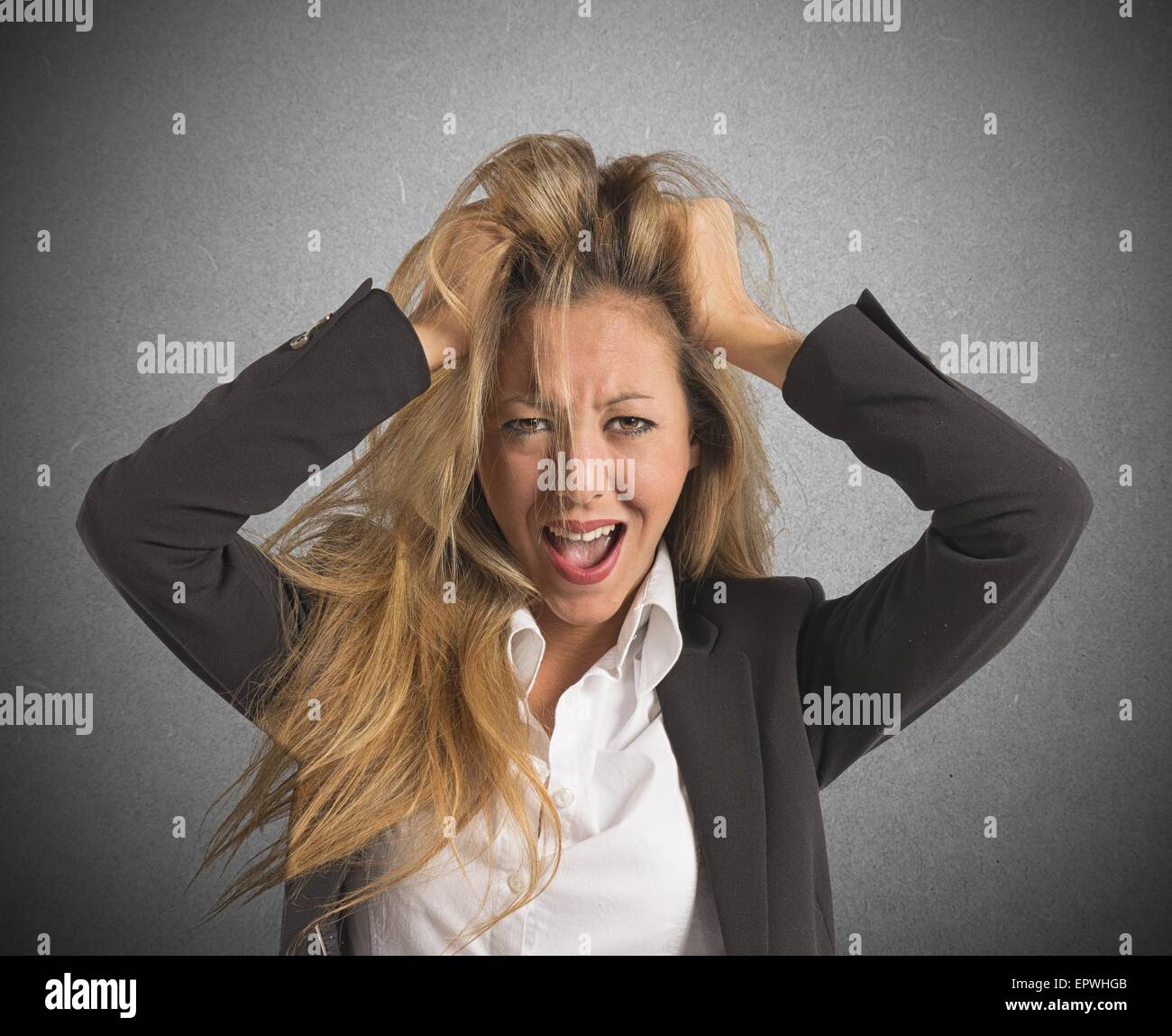 Businesswoman screaming desperate Stock Photo