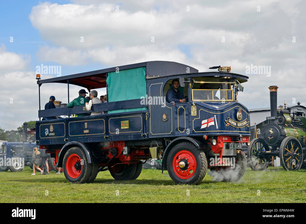 A Sentinel steam lorry shows off its power as it gives rides round the showground at a country fair. Stock Photo