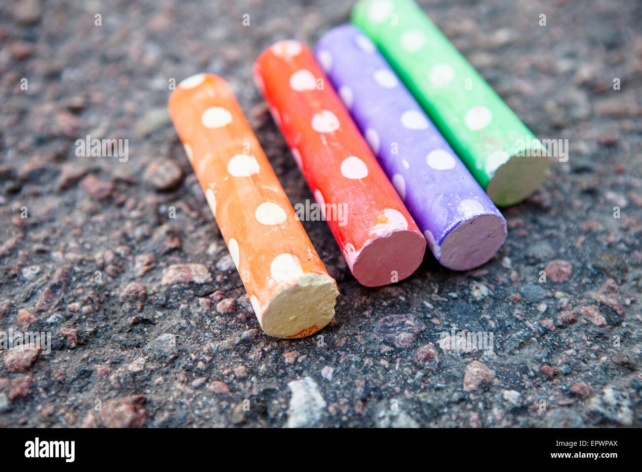 Colorful street chalk on asphalt outdoors Stock Photo