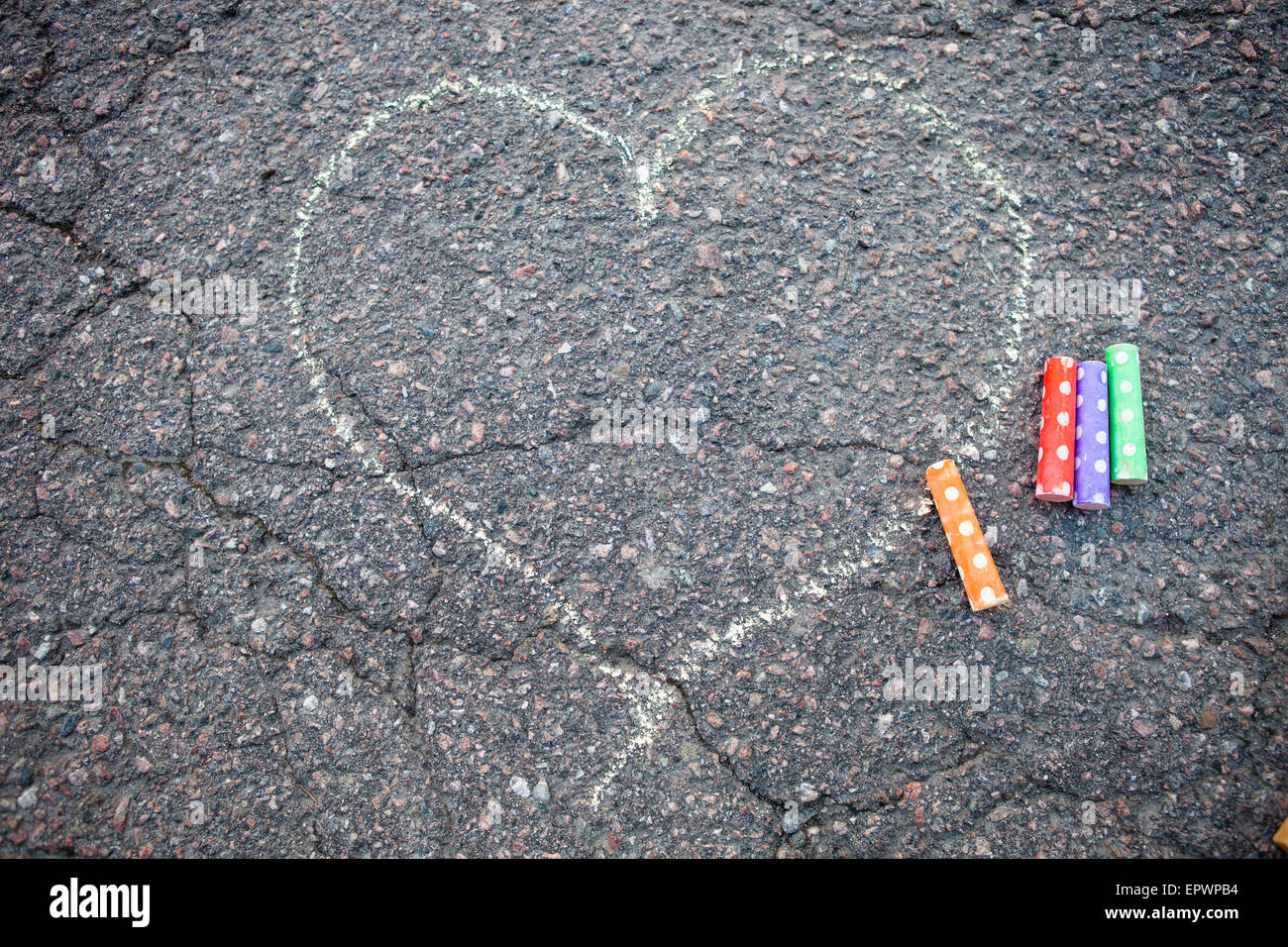 Street chalk drawing of a heart on asphalt Stock Photo
