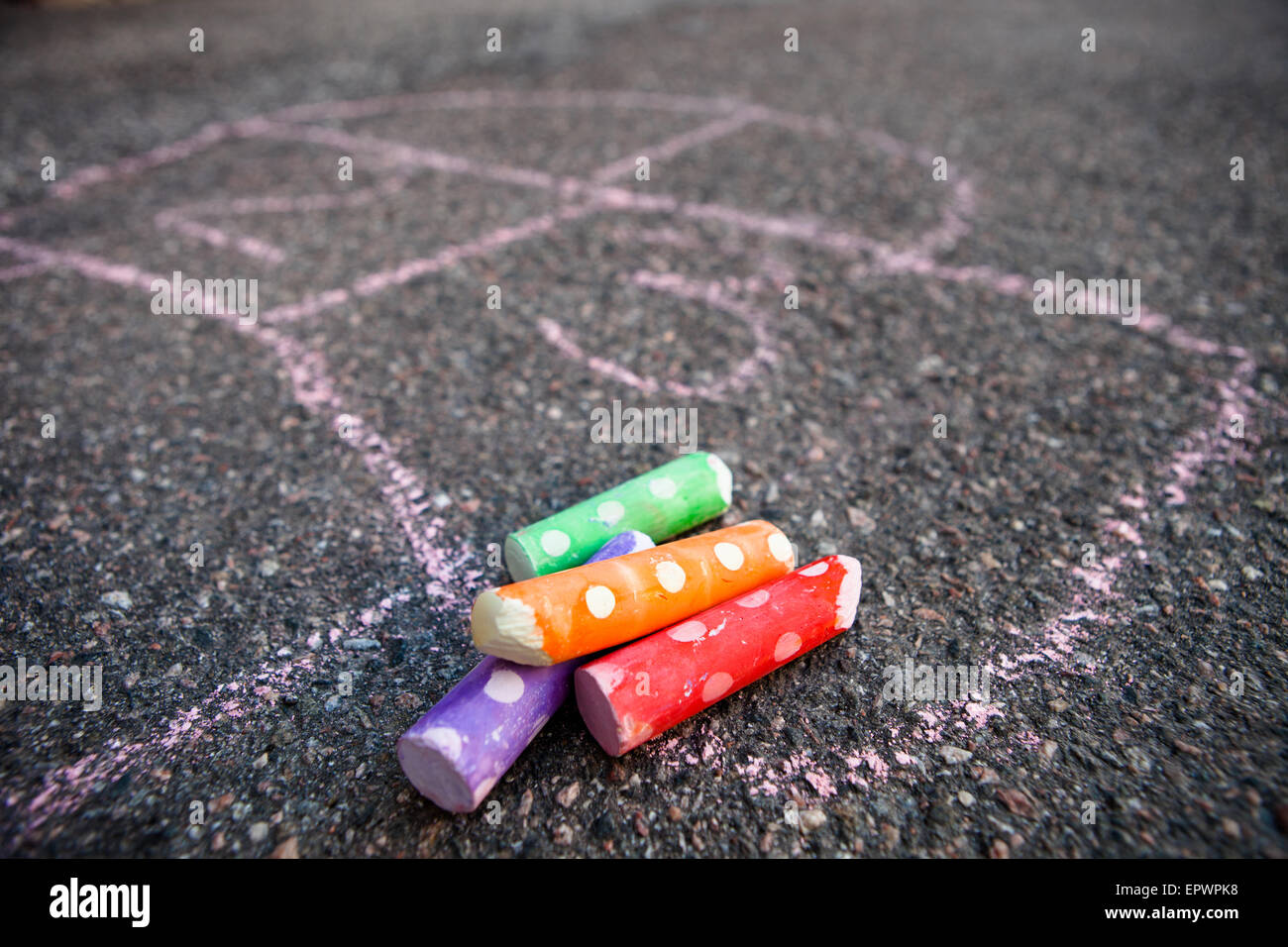 Hopscotch on the ground with colorful street chalk Stock Photo