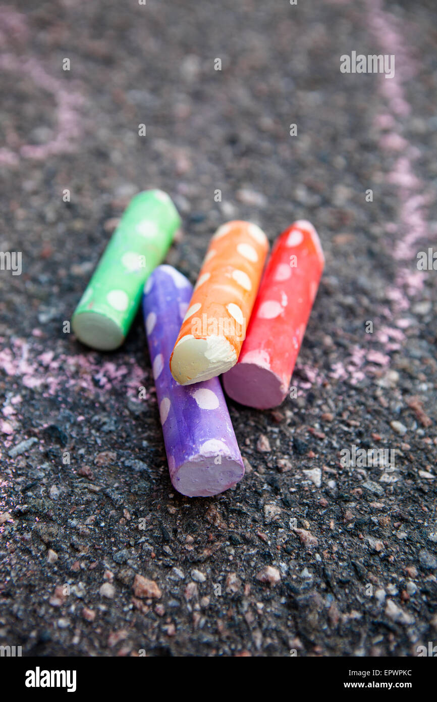 Colorful street chalk on asphalt Stock Photo