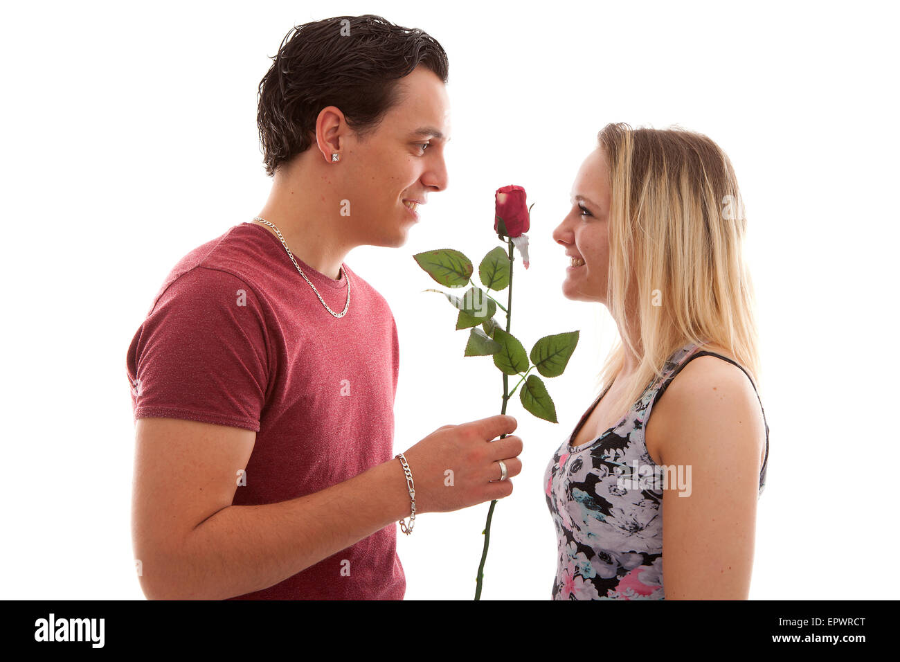 Girl is happy with rose giving by boyfriend over white background Stock