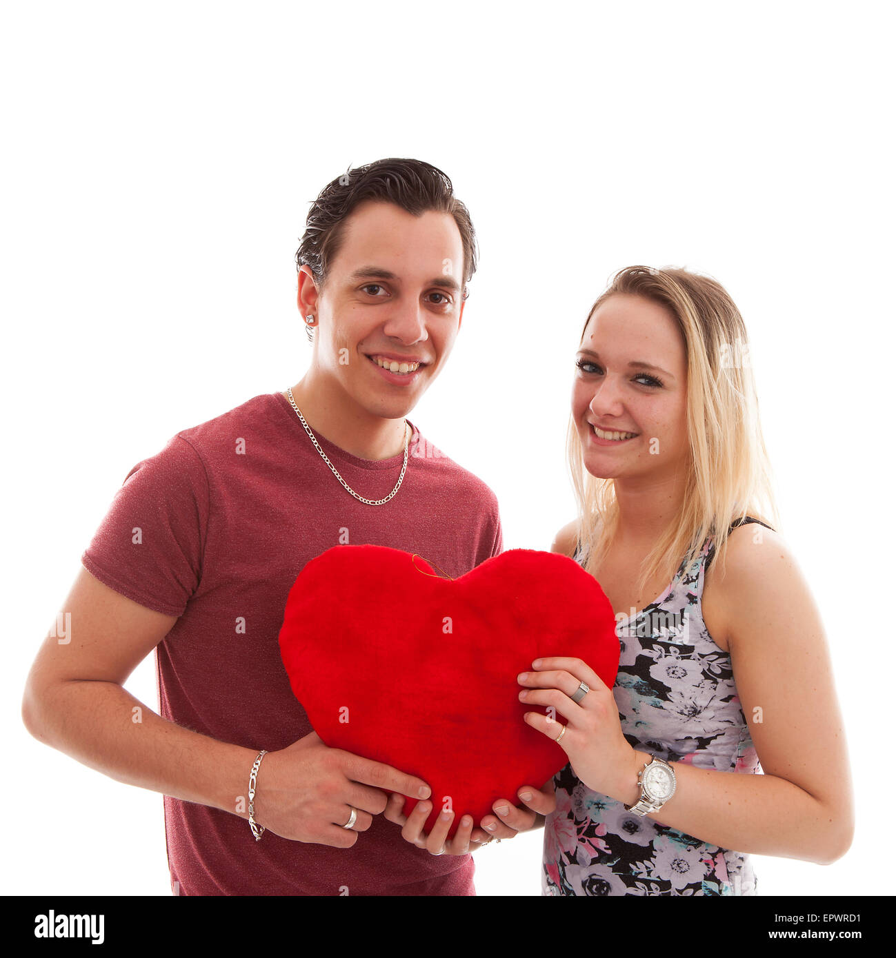 Young couple in love holding heart over white background Stock Photo ...