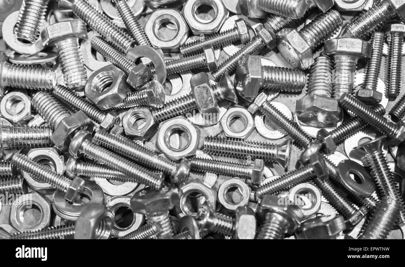 Shining bolts and nuts, photo background with selective focus Stock