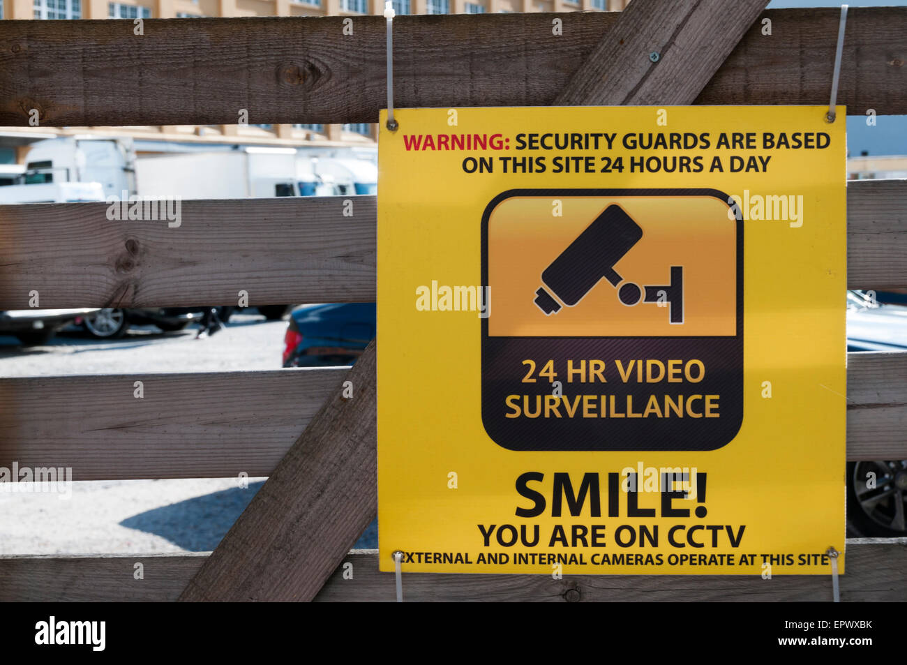 24 Hr Video Surveillance Smile! You are on CCTV sign. Stock Photo