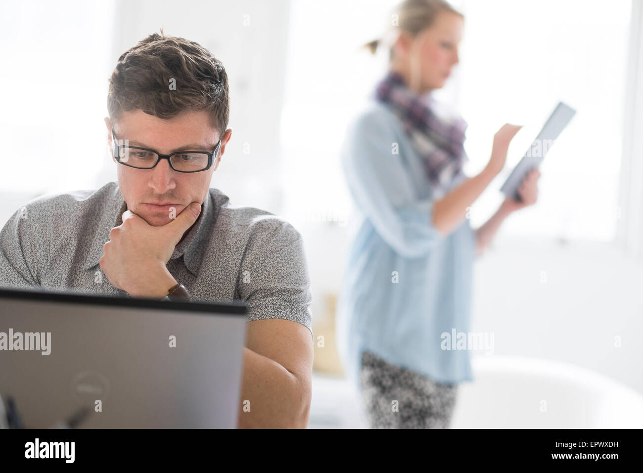 Man and woman working in office Stock Photo - Alamy