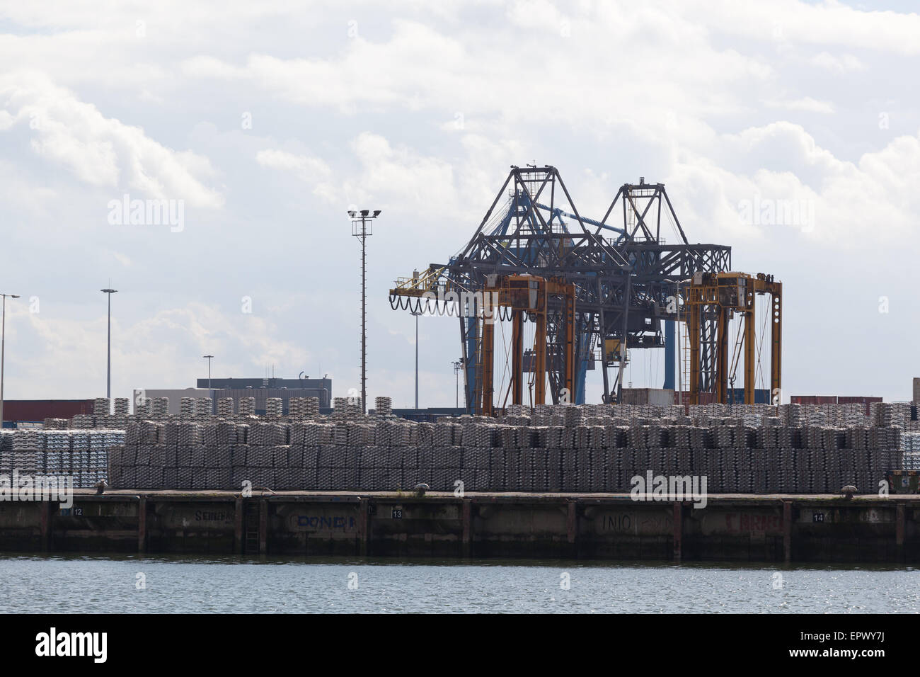 Loading unloading of containers with cargo in port Stock Photo - Alamy