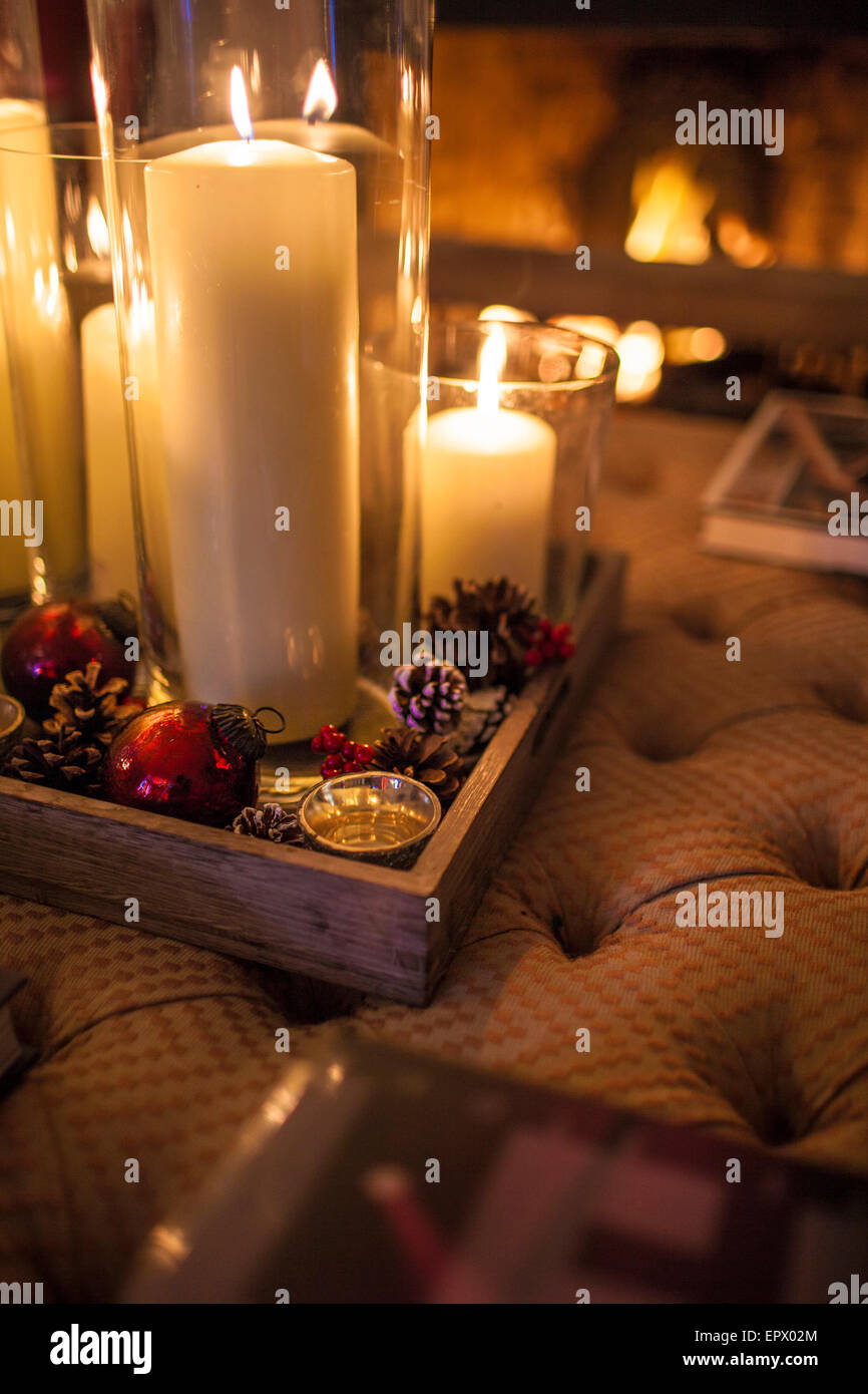 Lit candles and Christmas decorations in Chichester home, England, UK Stock Photo