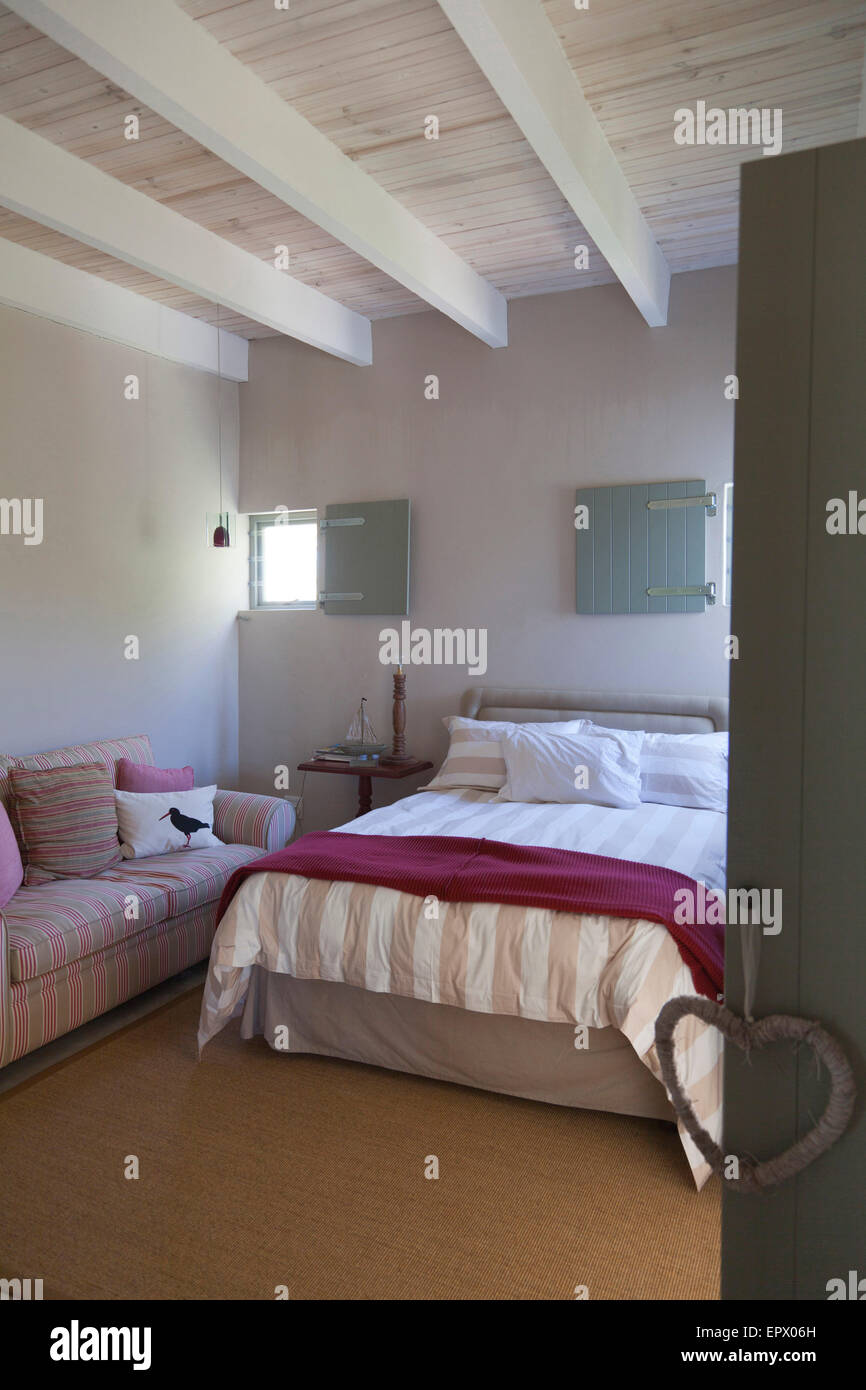 Beach Inspired Bedroom In Natural Tones With Sisal Carpet In South Stock Photo Alamy