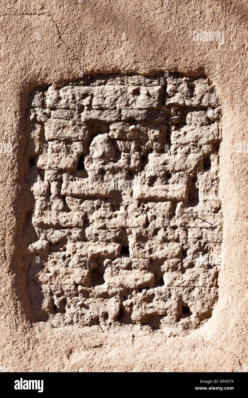 An adobe wall showing exposed adobe bricks, Santa Fe, New Mexico, USA. Stock Photo
