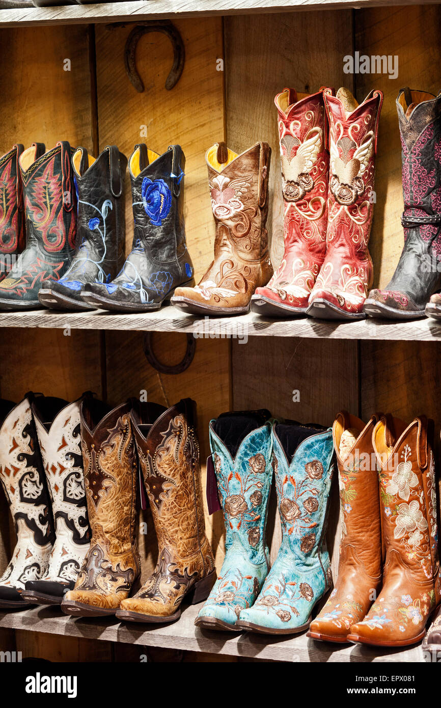 Traditional Cowgirl boots on a shelf in a store in Santa Fe, New Mexico, USA. Stock Photo