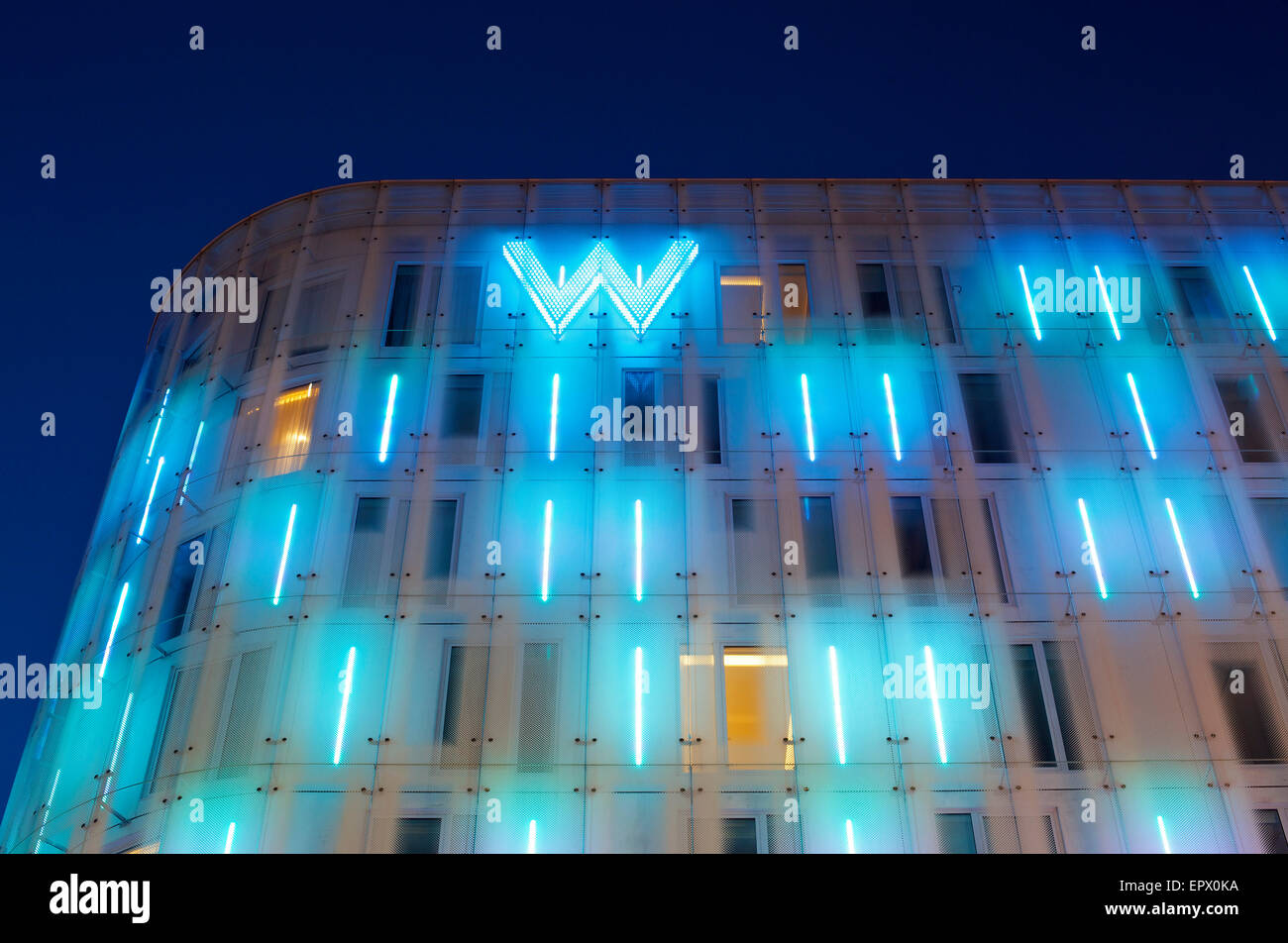 Lit neon exterior of W Hotel, Leicester Square, London, England, UK Stock Photo