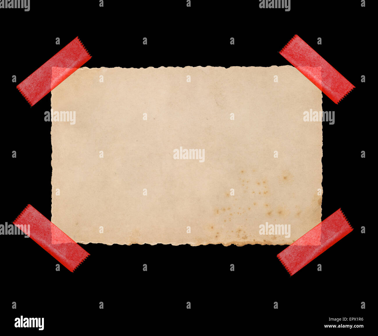 Used paper cardboard with red tape strips isolated on black background