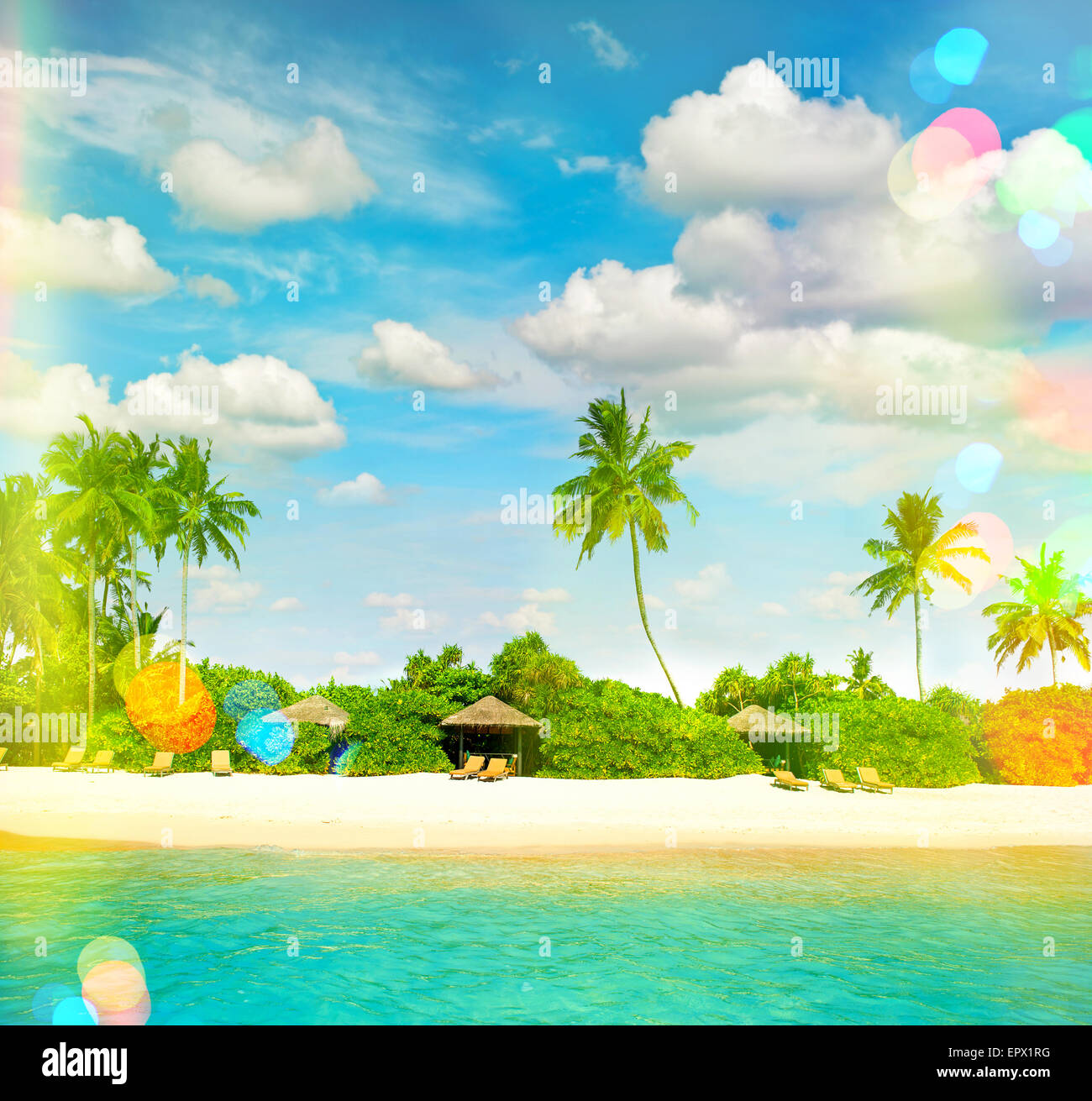 Tropical island sand beach with palm trees and cloudy blue sky. Retro ...