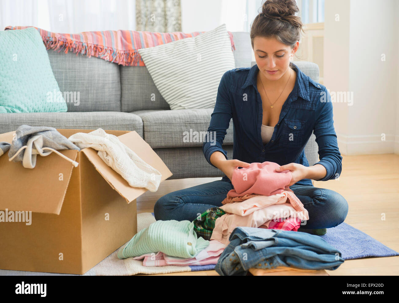Woman cardboard boxes clothes hires stock photography and images Alamy