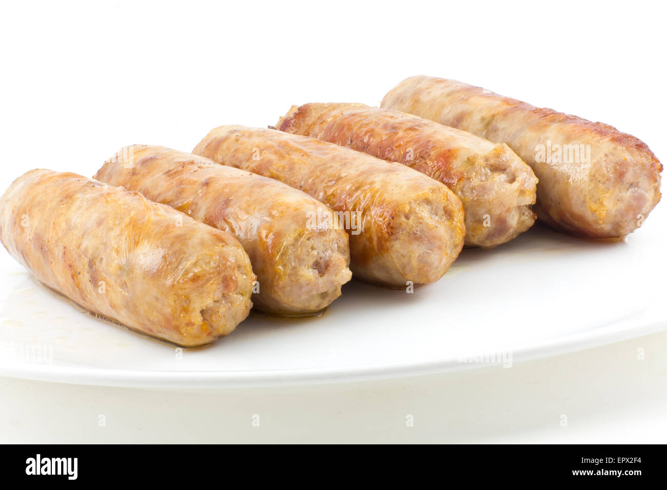 Cooked fried Italian sausage links isolated on white Stock Photo
