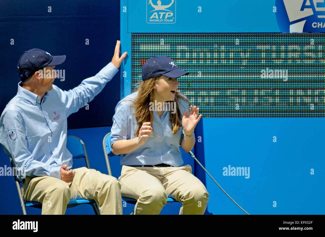 Aegon Tennis Championships, Queens Club, London, June10th 2014. Line judges react to the scoreboard nearly falling over Stock Photo