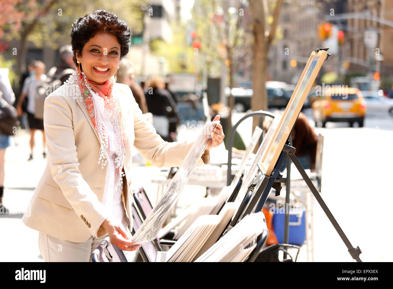 USA, New York State, New York City, Portrait of woman watching art on street Stock Photo