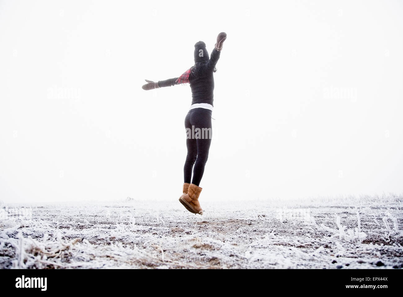 USA, Colorado, Woman jumping outdoors Stock Photo