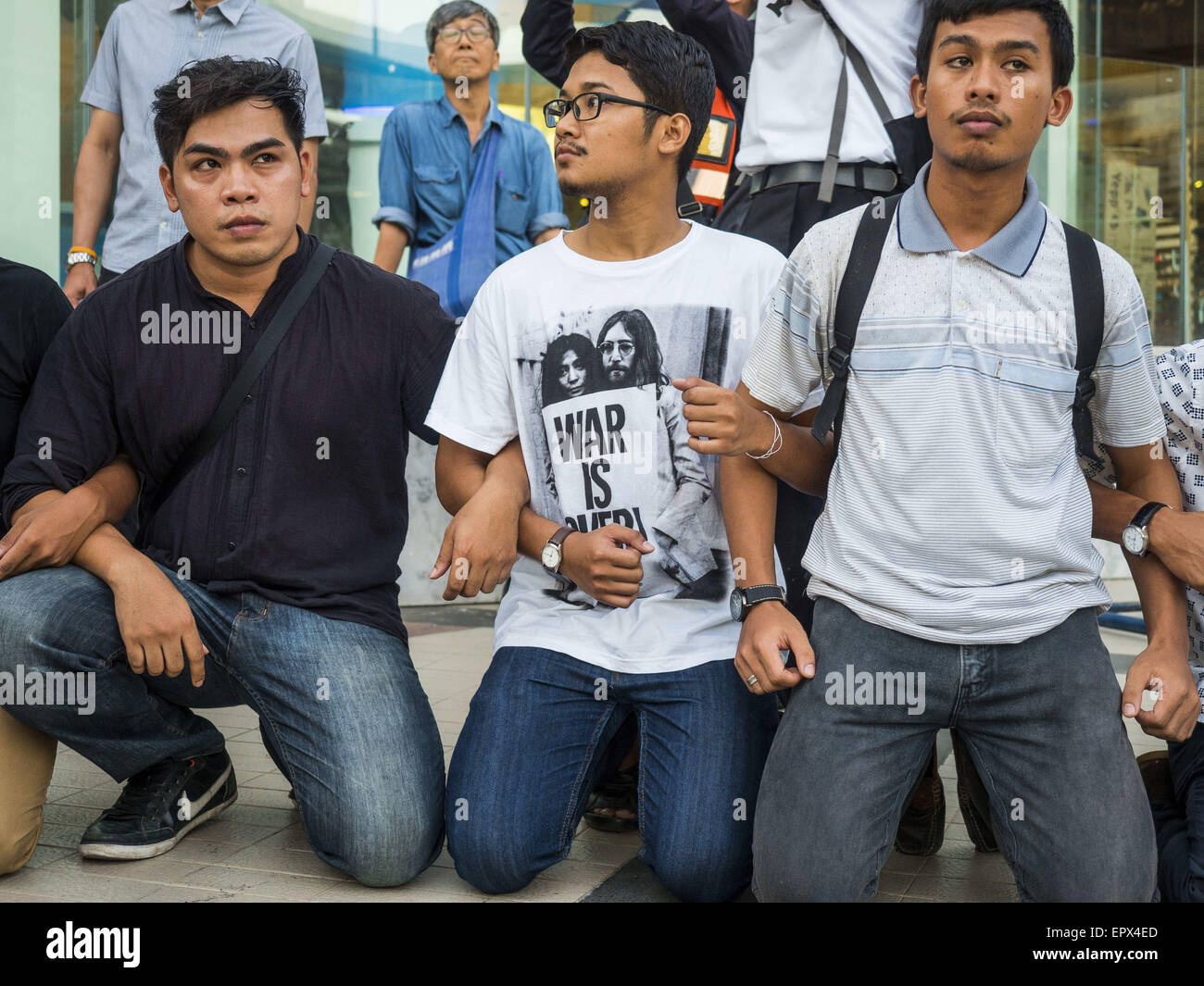 Bangkok, Thailand. 22nd May, 2015. Anti-coup protestors lock arms during a protest in front of the Bangkok Art and Culture Centre Friday evening. The Thai military seized power in a coup on May 22, 2014. There were small protests throughout Bangkok Friday to mark the first anniversary of the coup. Police arrested protestors at several locations. The most serious protest was at Bangkok Art and Culture Centre (BACC) where about 100 protestors, mostly students, faced off against police for several hours. Credit:  ZUMA Press, Inc./Alamy Live News Stock Photo