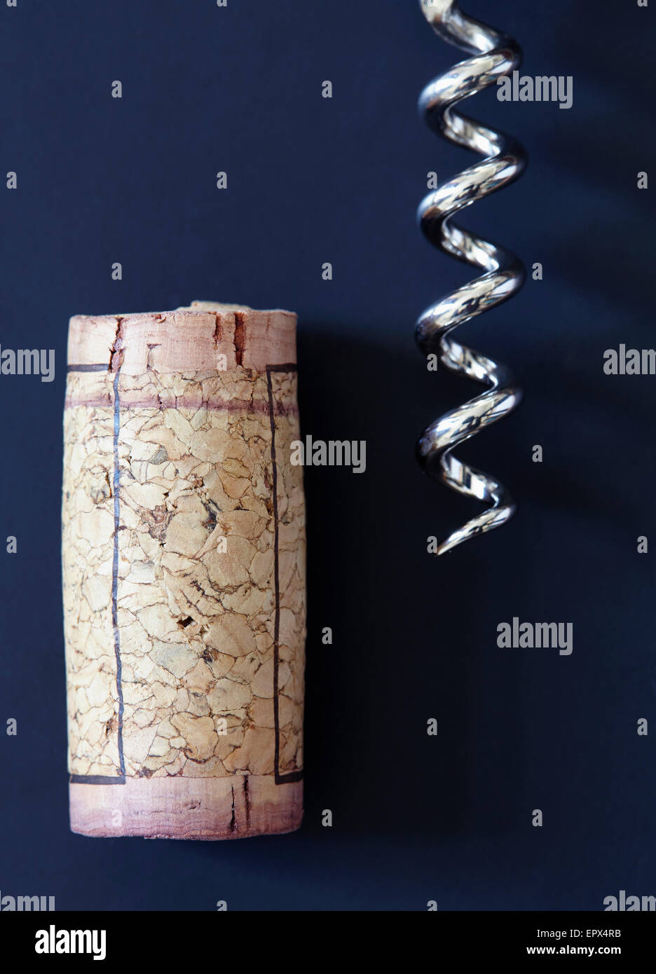 Corkscrew and wine cork Stock Photo