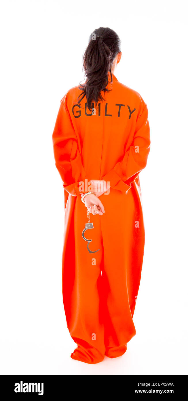 Rear view of a handcuffed Asian young woman in prisoners uniform Stock Photo