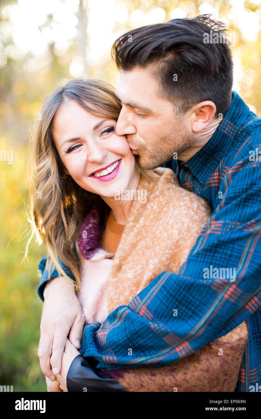 Man and woman kissing hi-res stock photography and images - Alamy