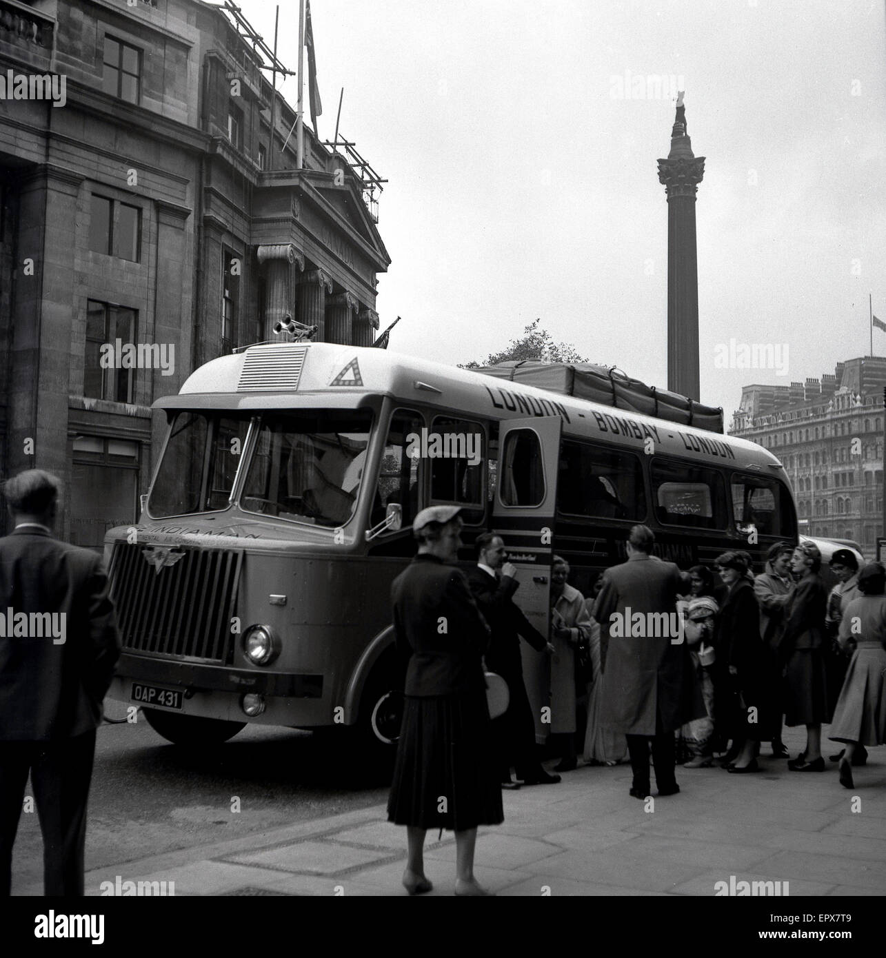 1950s historical, passengers awaiting to board 'The Indiaman', at Trafalgar Square, London, England, UK. A long-distance, trans-continental coach from London to Bombay, India and then back to London, it was the world's longest coach route. Stock Photo