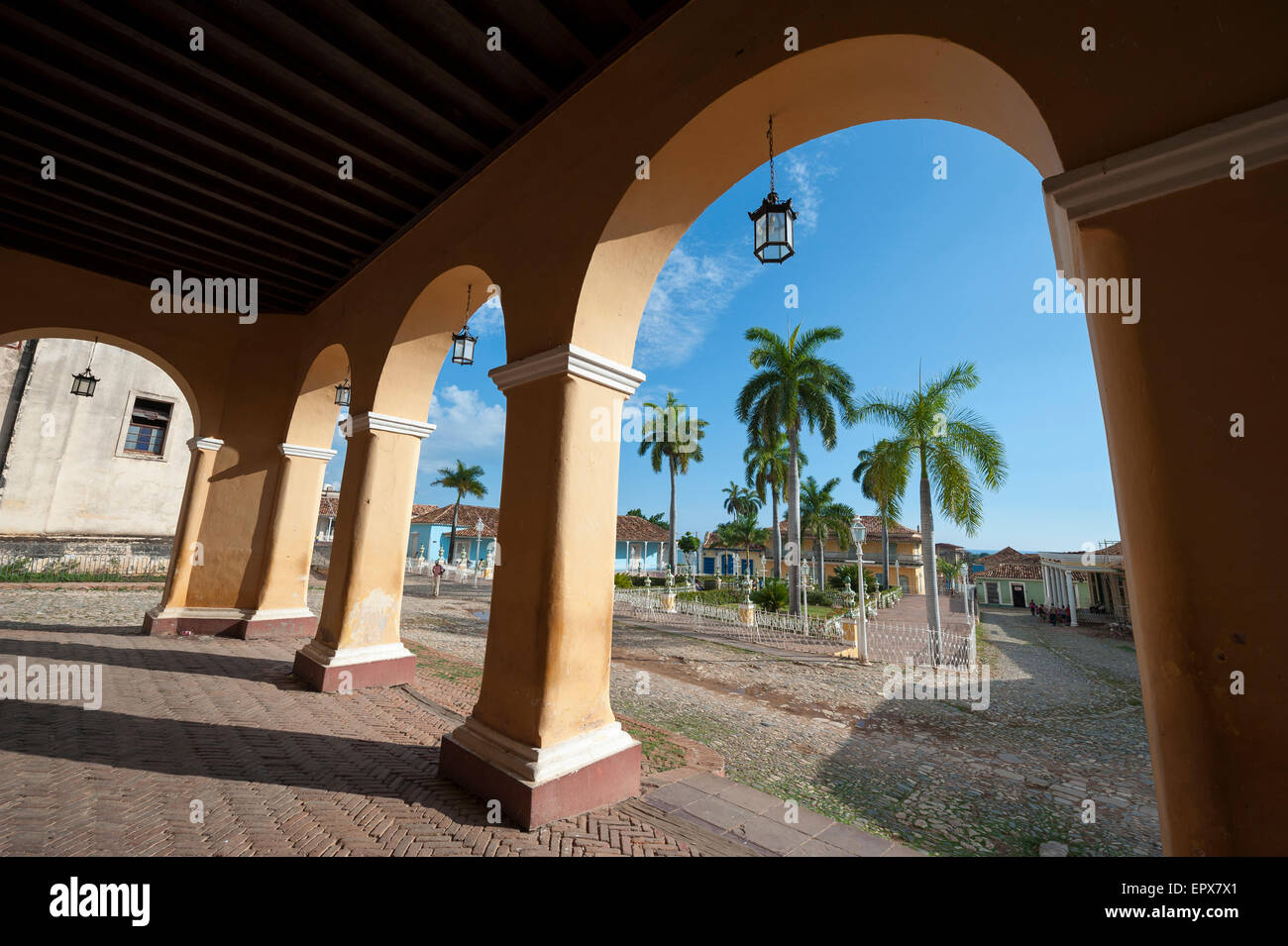 View of the Plaza Mayor between archways in the portico of the historic colonial architecture of the Palacio Brunet Stock Photo
