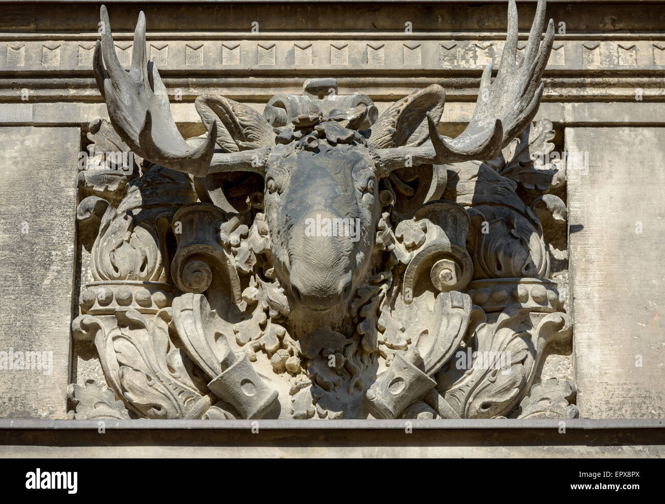 Decorative altorelievo with moose head on Gate side wall in