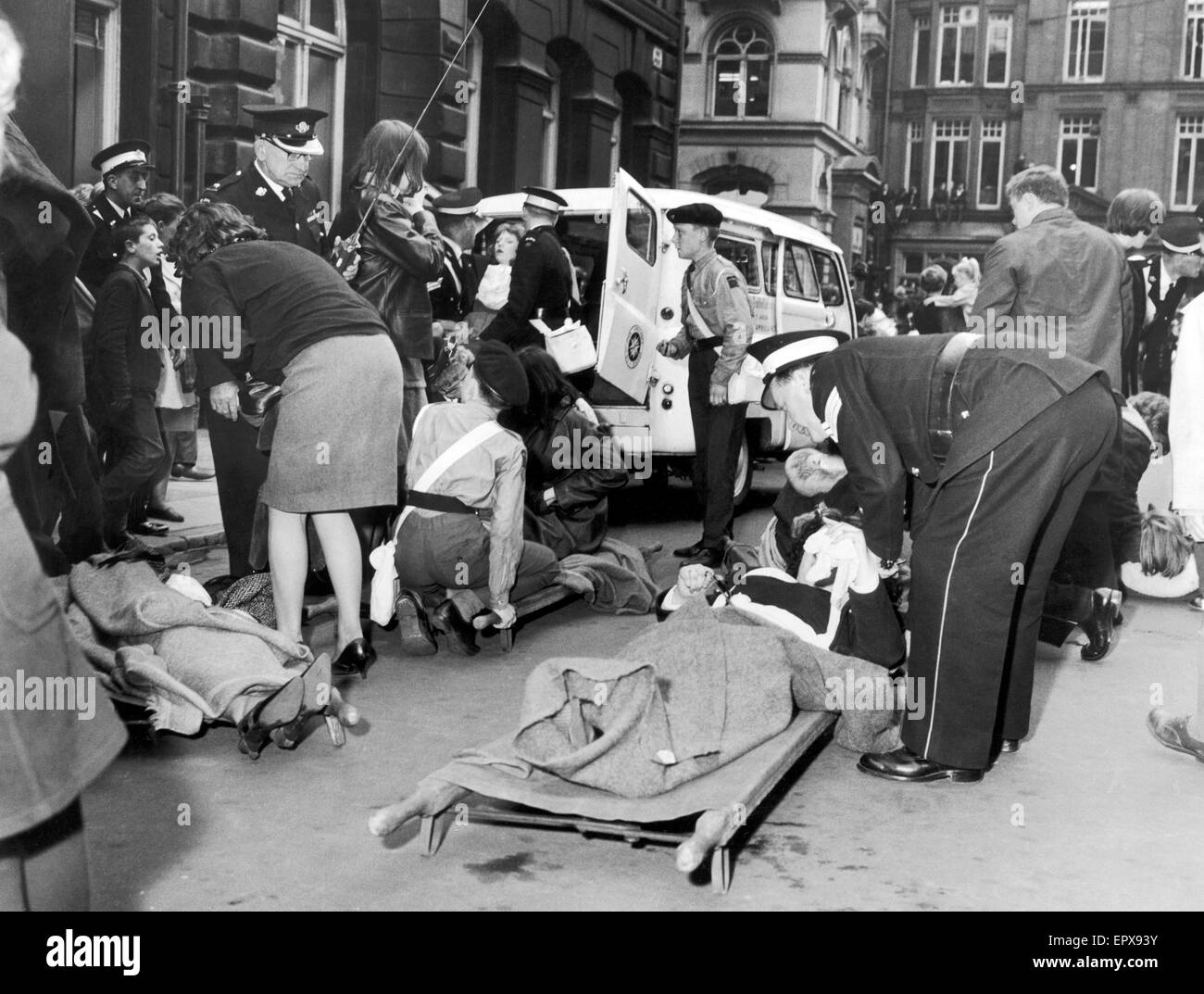 The Beatles in Liverpool, Friday 10th July 1964.  Back home for evening premiere of 'A Hard Day's Night' at the Odeon Cinema. Pictured, girls feeling faint, are cared for outside Town Hall. Stock Photo