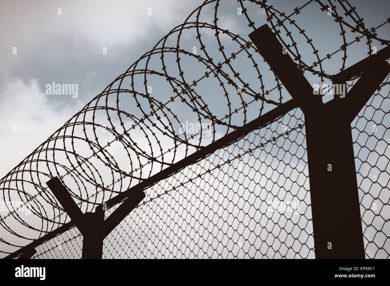 Fence with a barbed wire, silhouette illustration Stock Photo