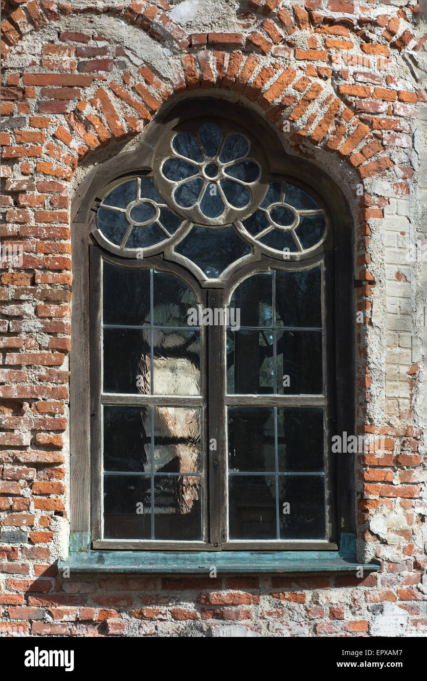 Aging and Weathered Window on Rough Stuccoed Wall Stock Photo