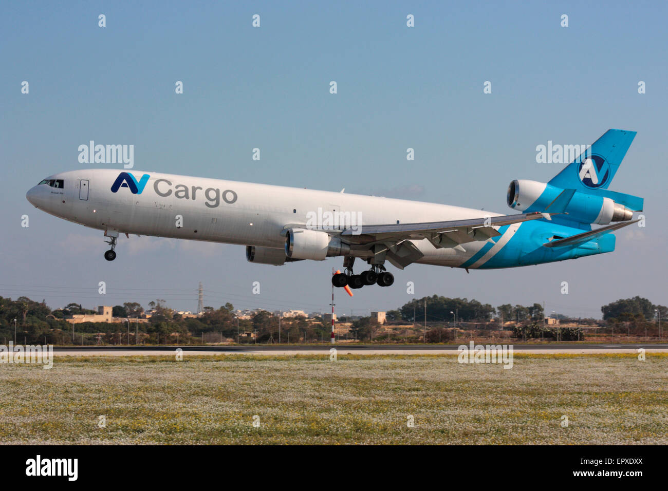 McDonnell Douglas MD-11F transport plane belonging to AV Cargo on arrival in Malta. Worldwide air freight delivery. Stock Photo