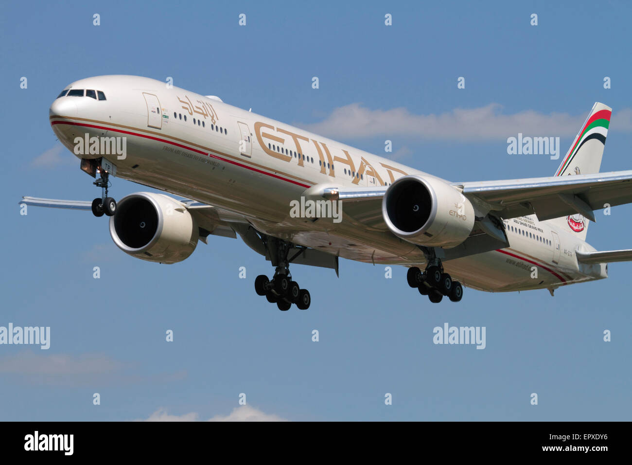 Boeing 777-300ER long-haul widebody airliner belonging to Abu Dhabi airline Etihad on approach. Close-up front view. Stock Photo