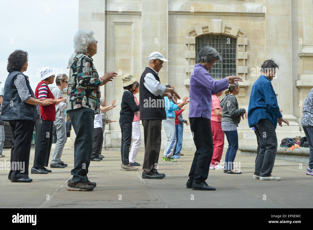 St Martin's in the Fields, London, UK Chinese community take part in a Tai Chi class for pensioners Stock Photo
