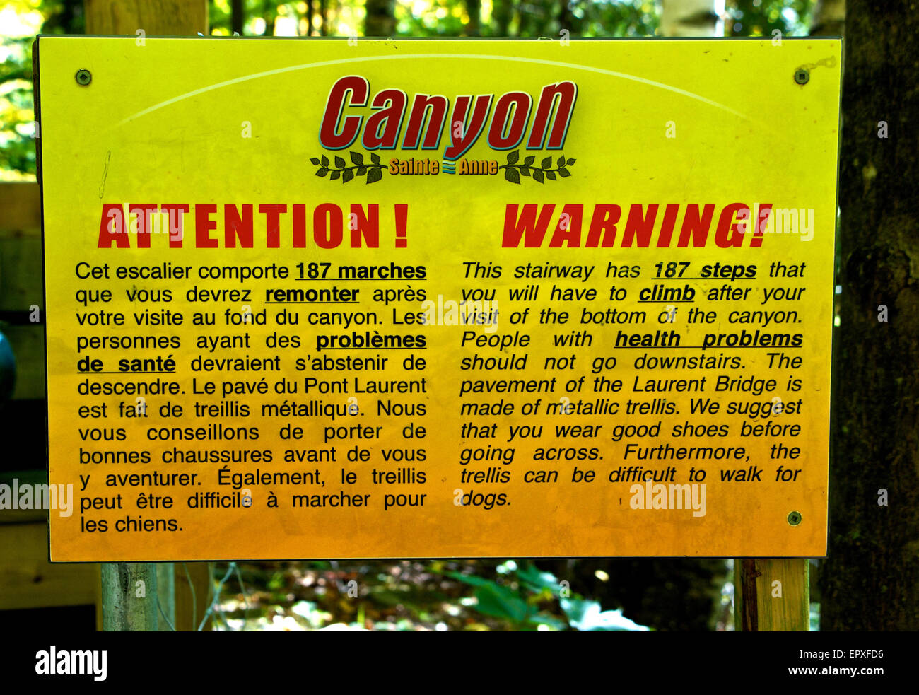 Sign warning steep staircase with many steps Canyon Sainte Anne River Park Stock Photo