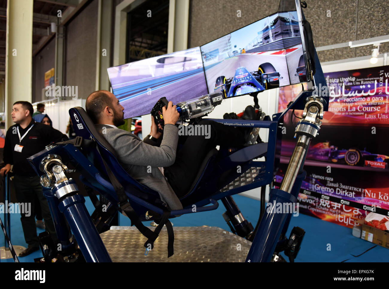 Istanbul, Turkey. 22nd May, 2015. A visitor experiences driving F1 racing car by auto game at Istanbul Autoshow 2015, Istanbul, Turkey, on May 22, 2015. Auto firms from the world displayed their cars including new energy vehicles at Istanbul Autoshow 2015 which was open on Friday. © He Canling/Xinhua/Alamy Live News Stock Photo