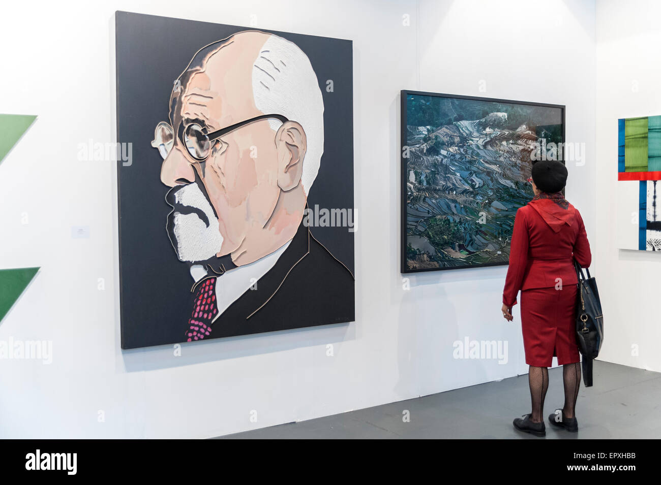 London, UK. 22 May 2015. A visitor looks at 'S. Freud' by Lee Waisler at Art15, a global art fair currently taking place at Kensington Olympia.  Work from artists from over 40 countries is showcased - from emerging artists to modern masters. Credit:  Stephen Chung / Alamy Live News Stock Photo