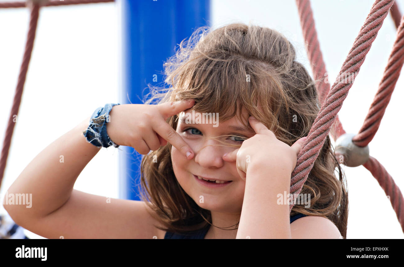 Young girl makes a silly pose Stock Photo