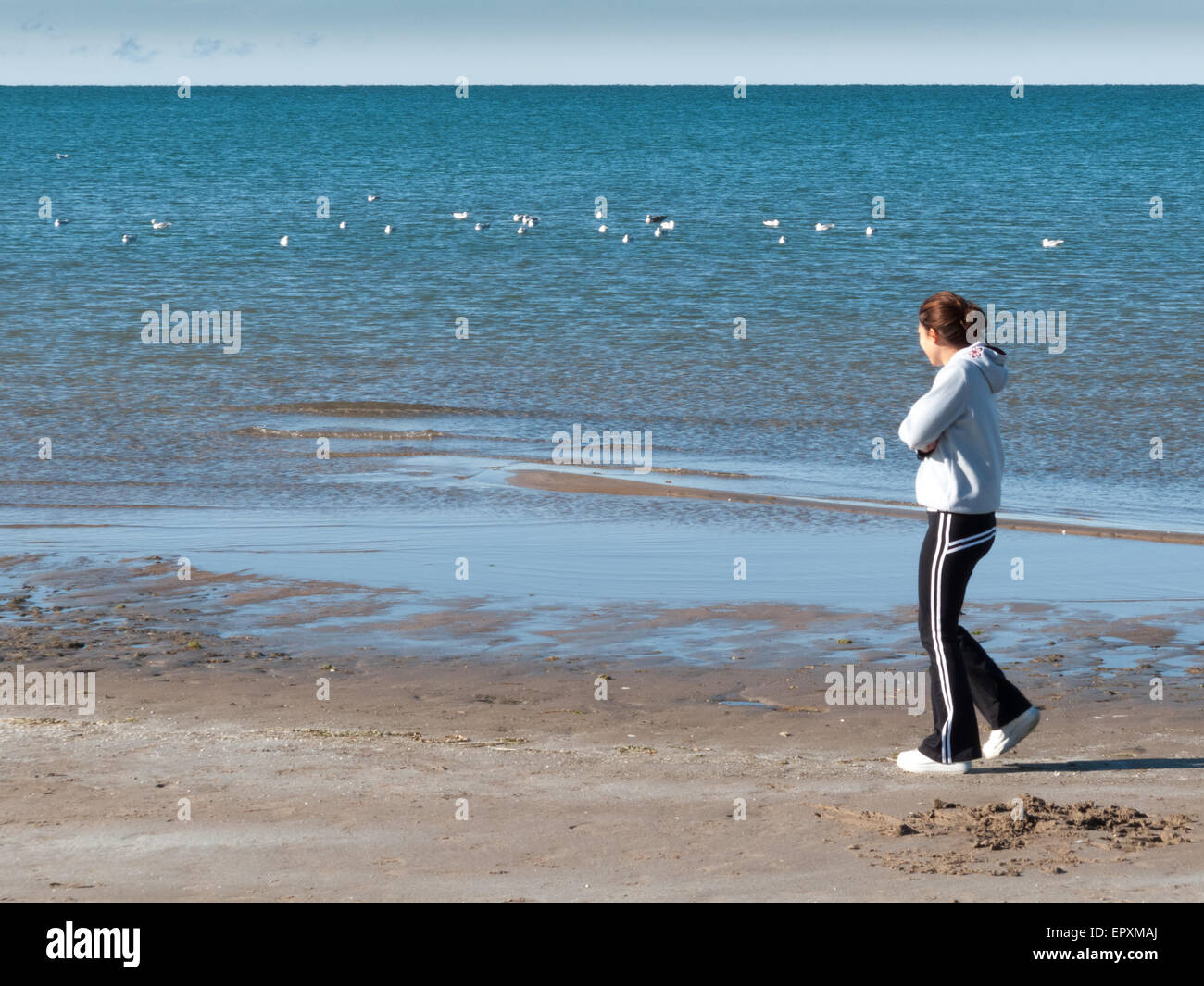 Beach Rode Side Profile Side profile of a woman walking on the beach Stock Photo - Alamy