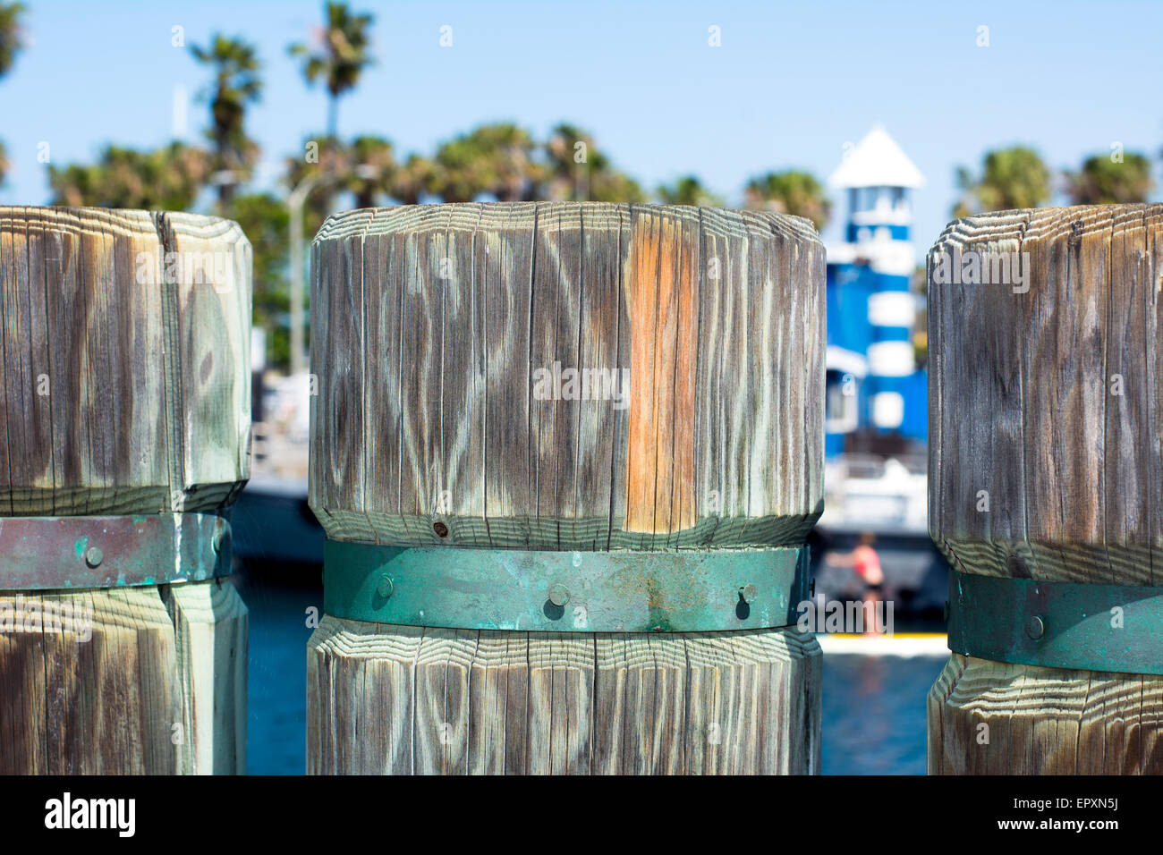 A close up of a wooden support post on a shoreline boardwalk in Redondo Beach California Stock Photo