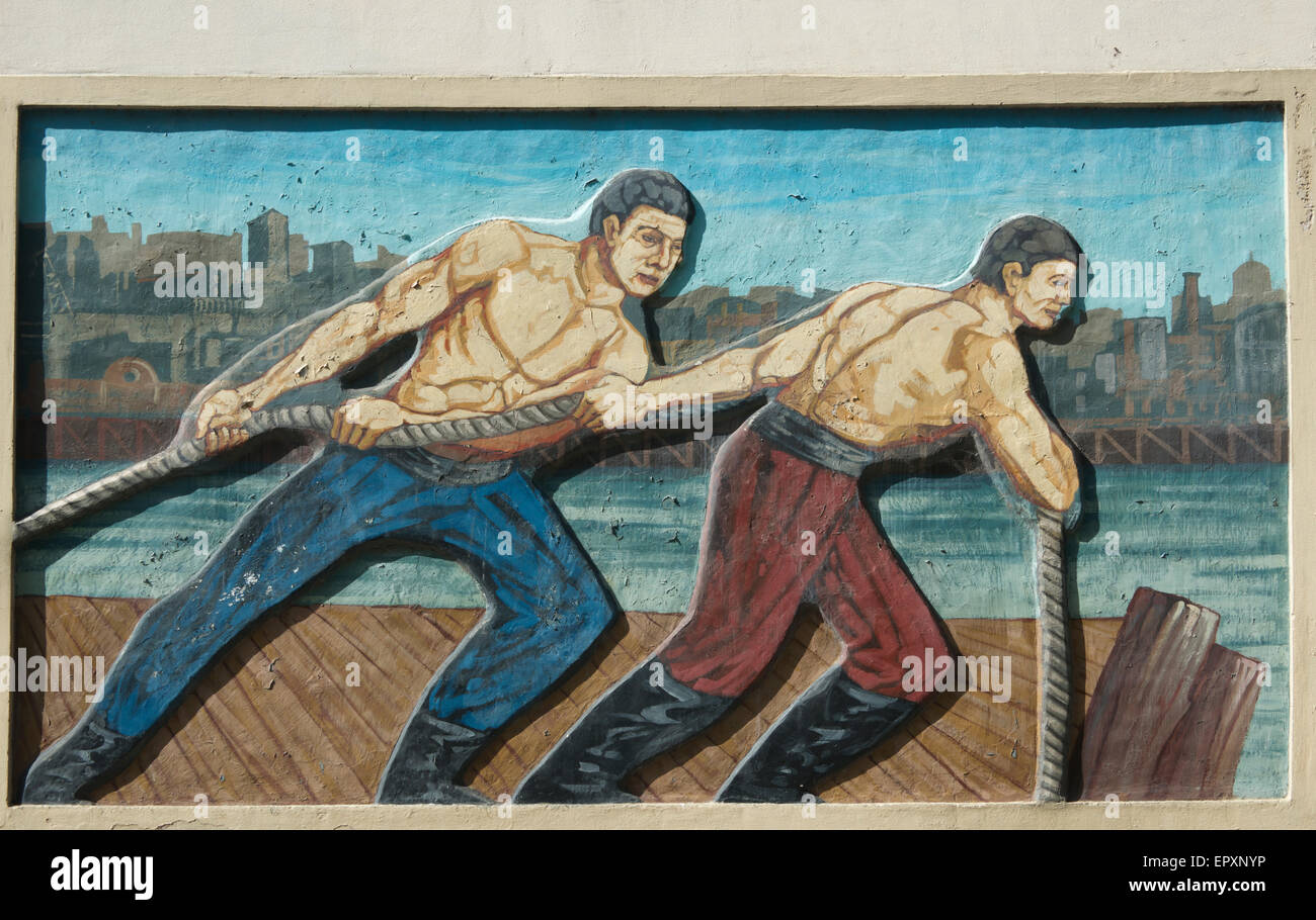 Bas relief mural La Boca two men pulling on rope Buenos Aires Argentina Stock Photo