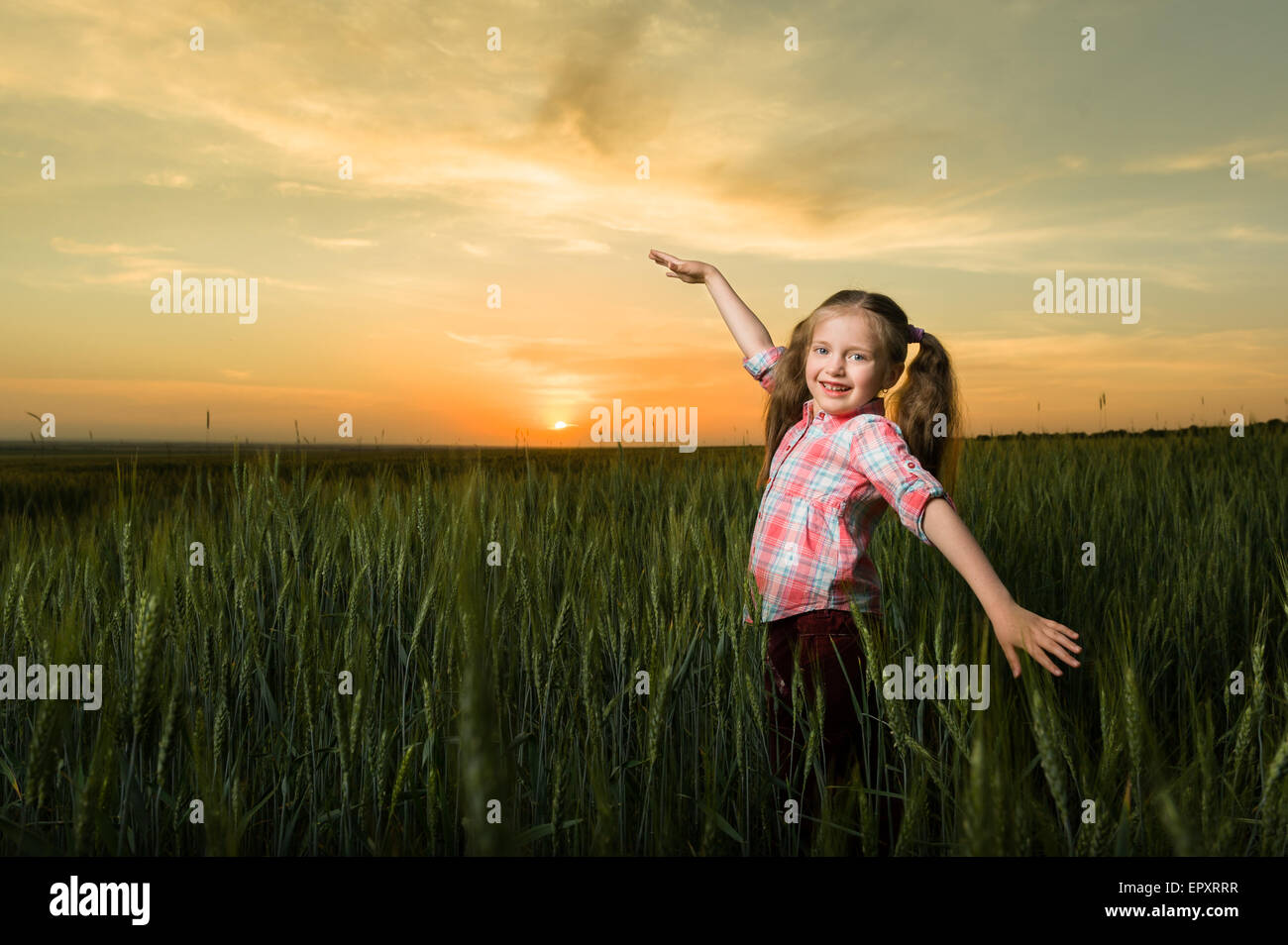 girl child portrait in the field at sunset Stock Photo - Alamy
